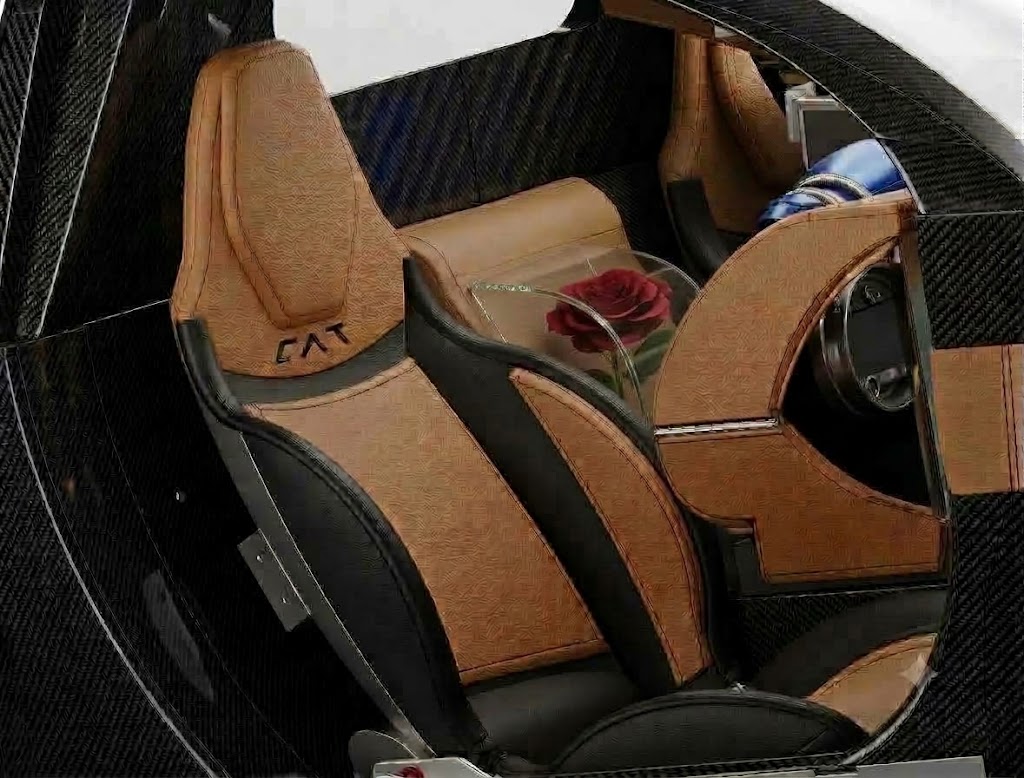 CAT Automotive leather seat with CAT branding and carbon fiber monocoque